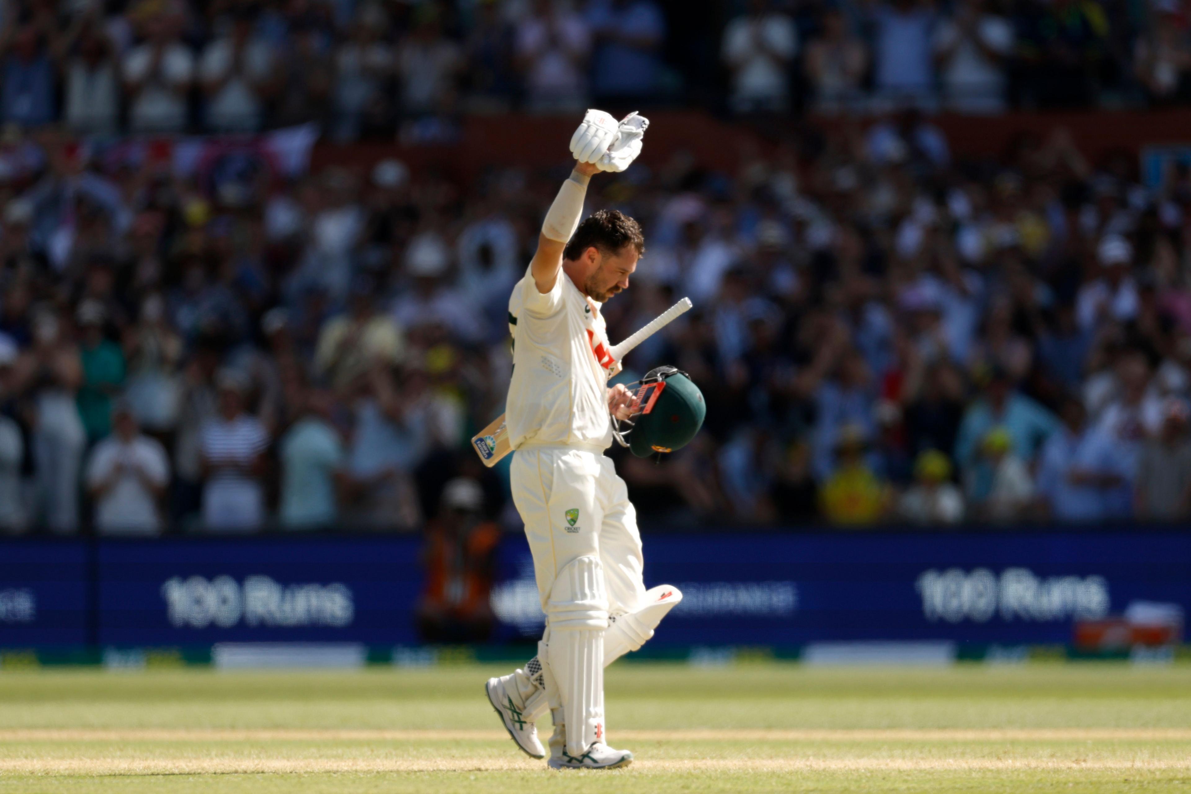 Australia opener Travis Head acknowledges the fans after scoring a century on day three at the Adelaide Oval