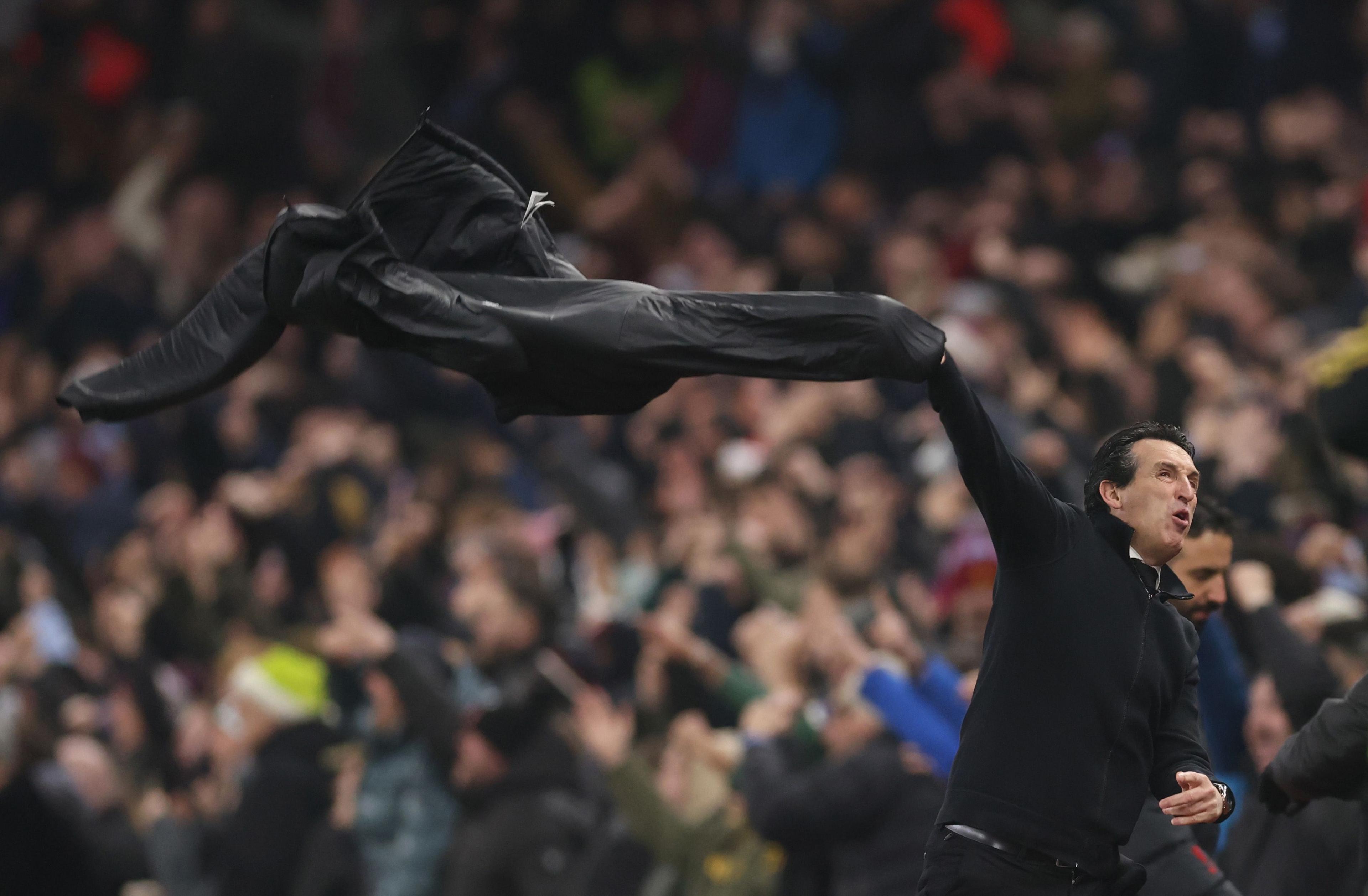 Aston Villa manager Unai Emery throws his coat in the air after Morgan Rogers puts the hosts 2-1 up in the Premier League match against Manchester United at Villa Park