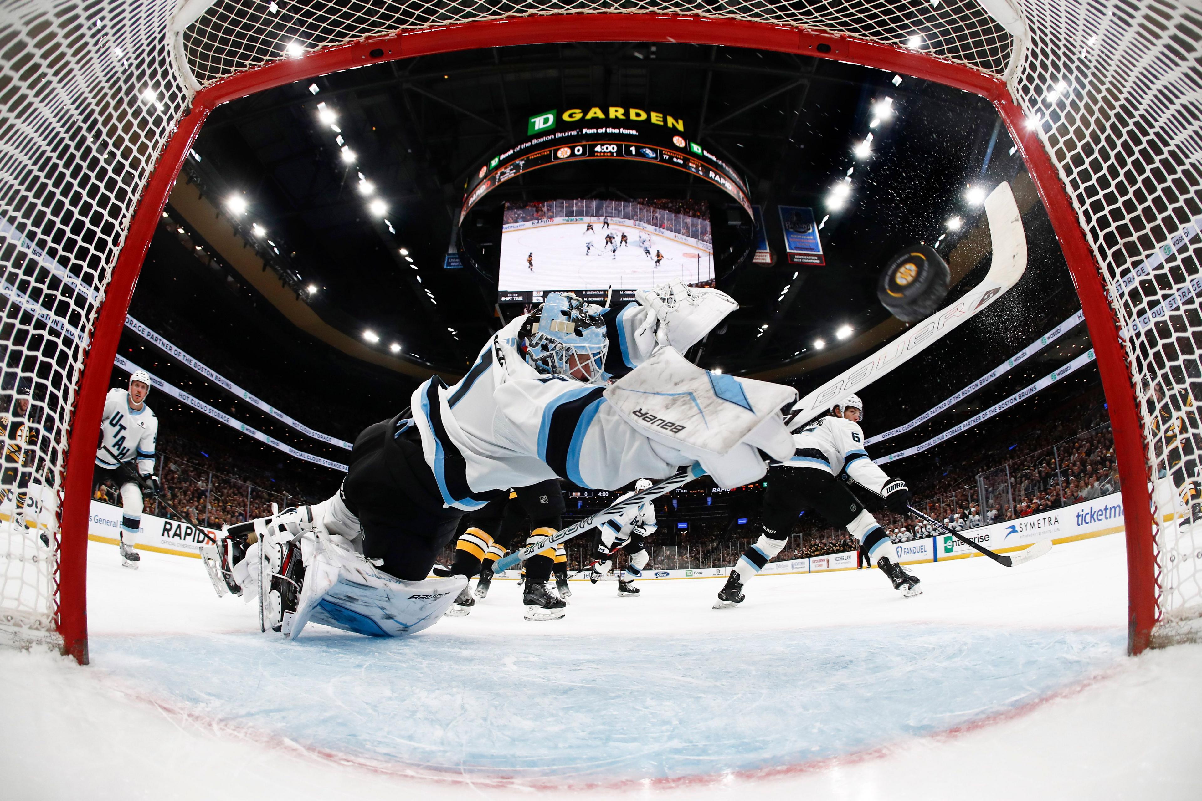 Utah Mammoth goaltender Vitek Vanecek dives but cannot stop a shot by Boston Bruins' Morgan Geekie in their NHL match at TD Garden in Boston, Massachusetts
